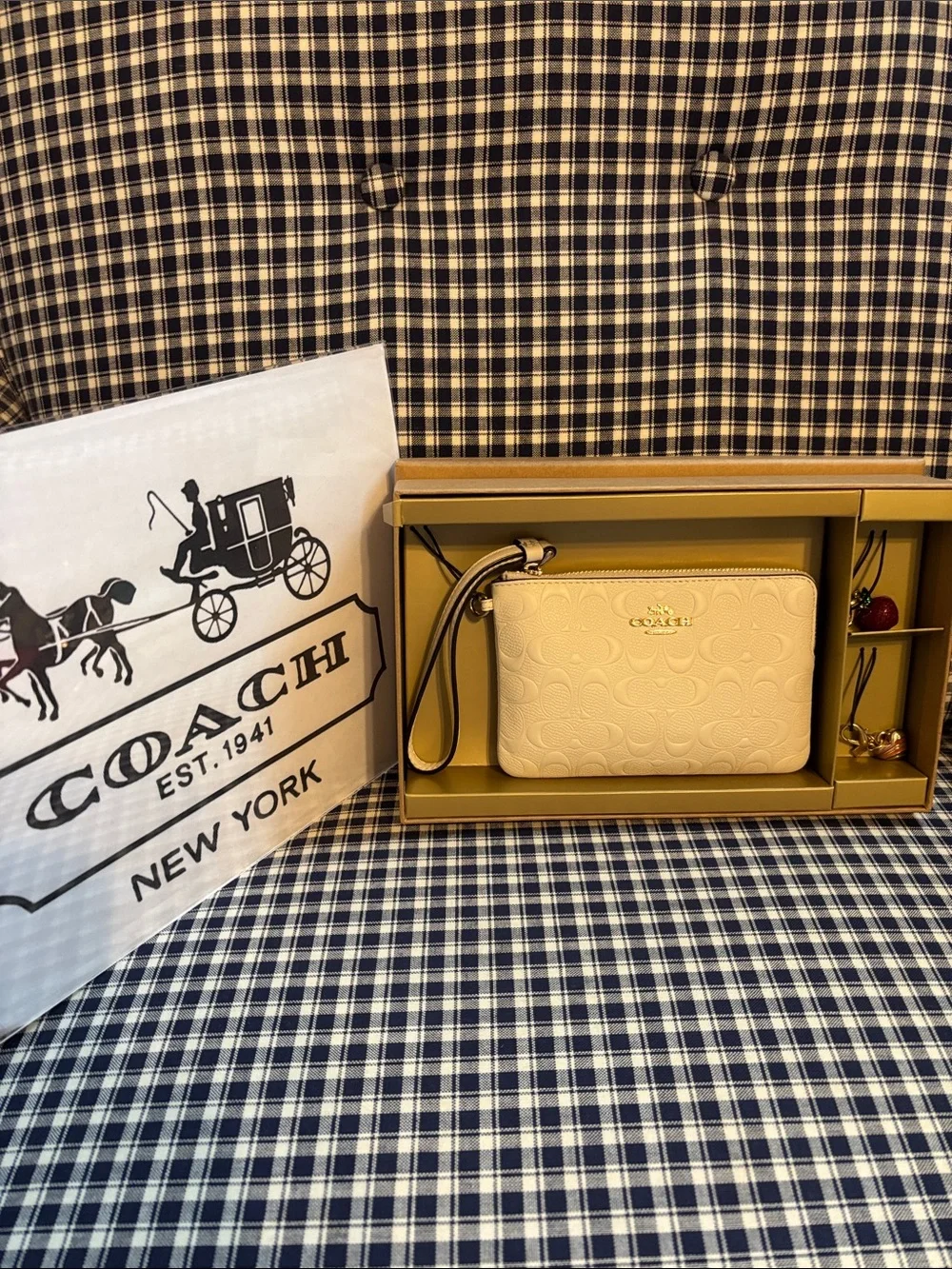 Coach Buttercream Embossed Leather Wristlet with two charms